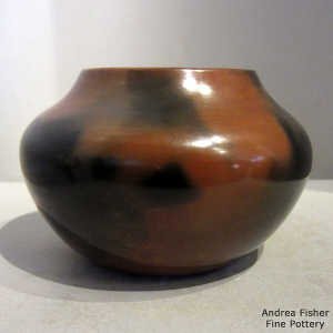 Click to see a larger version Pine pitch coating on a brown jar with fire clouds