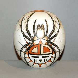 Click to see a larger version Sun-face spider design on a polychrome white ware seed pot