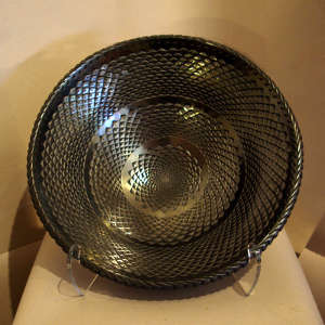 Click for a larger version A basket weave design carved into a large graphite black bowl