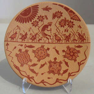 Click for a larger version Sgraffito fish, turtle, quail, kokopelli and geometric design on a red plate