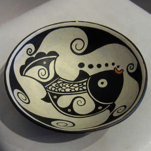 Click to see a larger version Fish and water designs inside and water design outside on a polychrome bowl